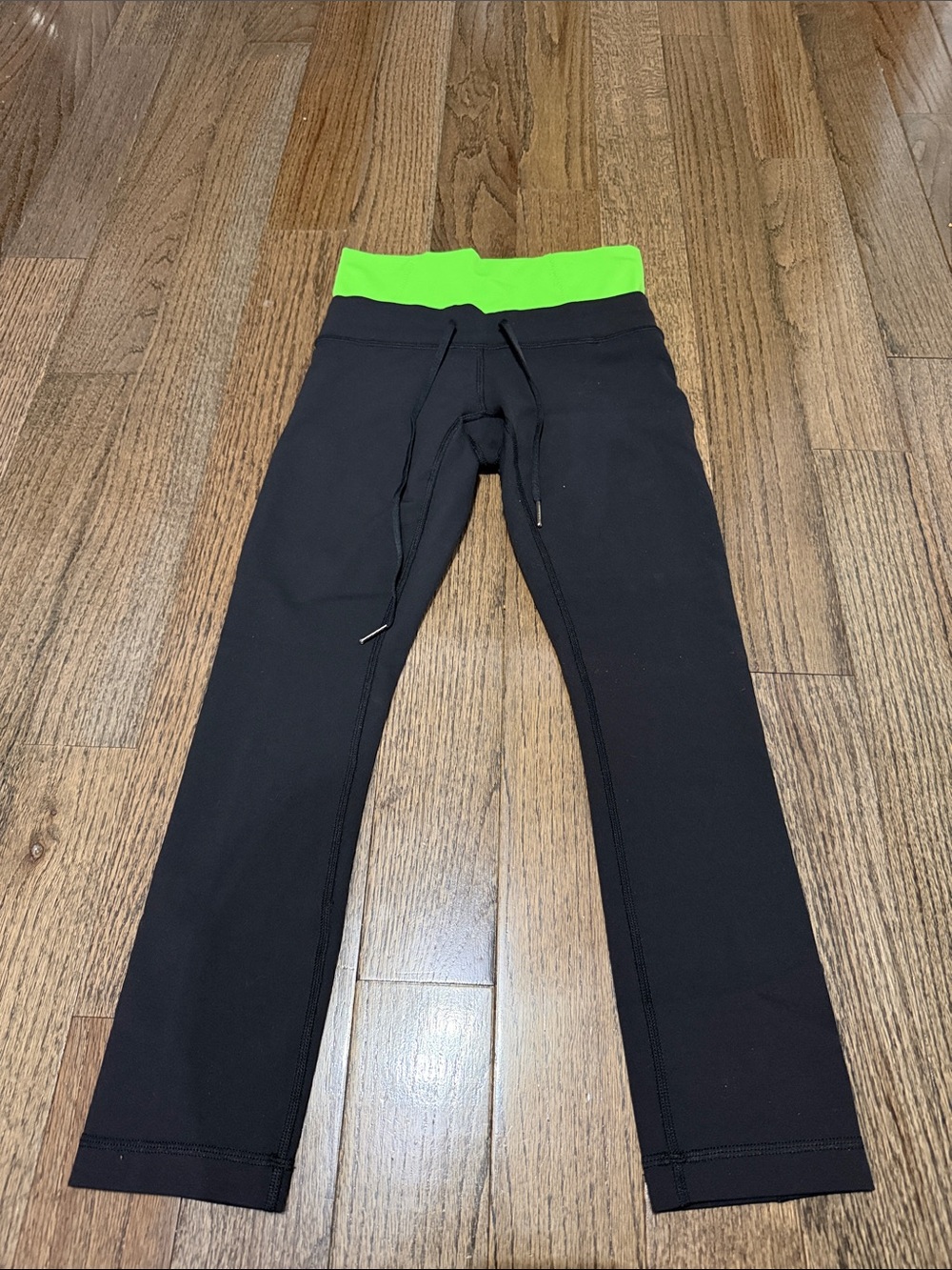 Lululemon Black Leggings with Neon Green Waistband 22” inseam NWOT